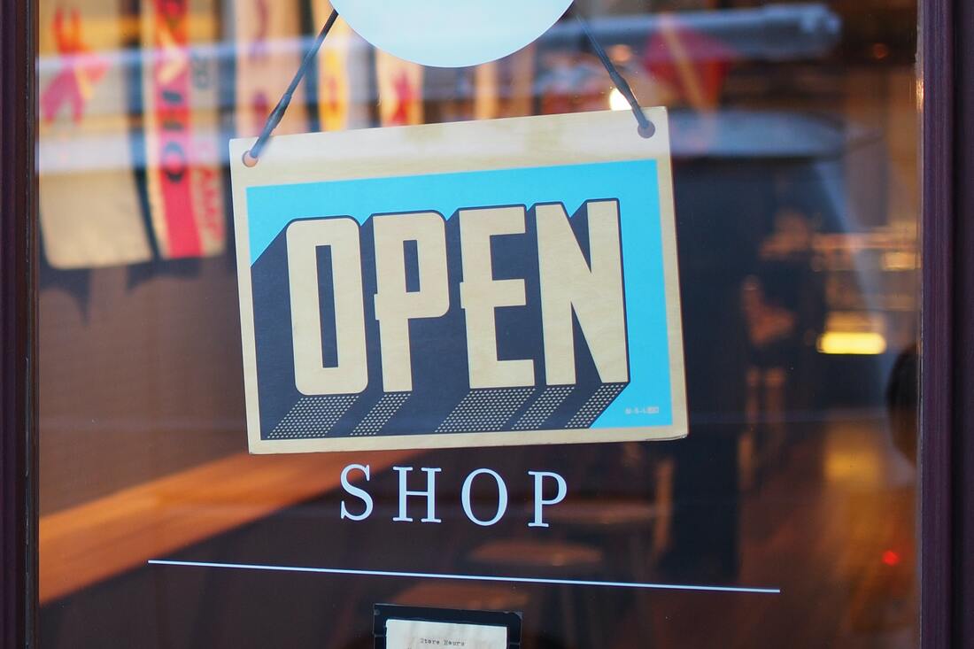 Photo of a store open sign. Photo by Mike Petrucci on Unsplash